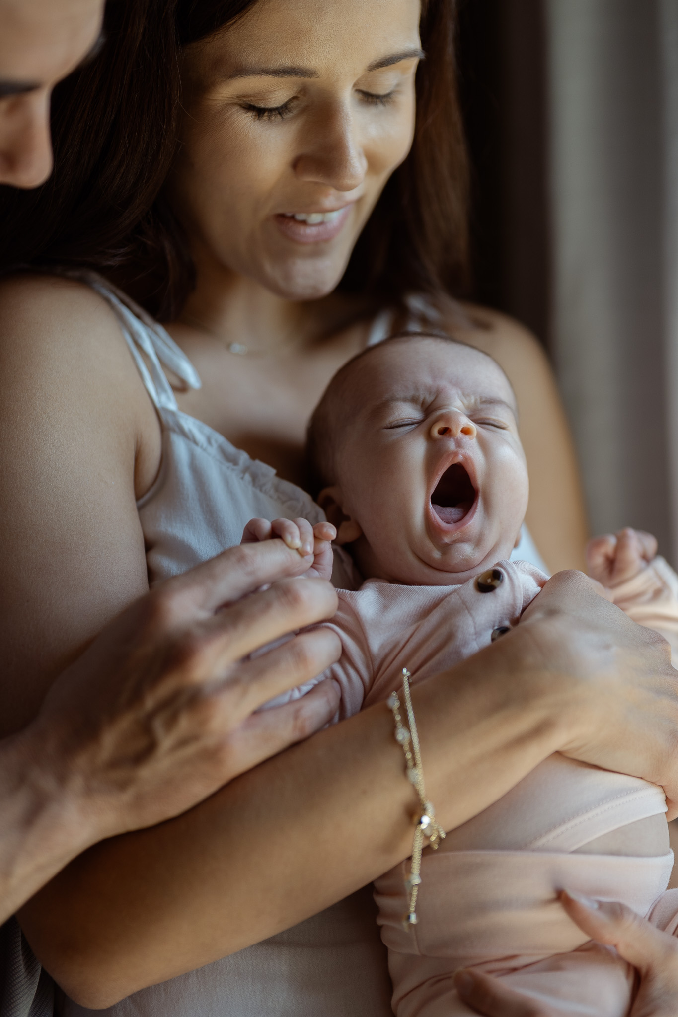 Baby yawning softly during lifestyle newborn photography at home in Fort Worth.