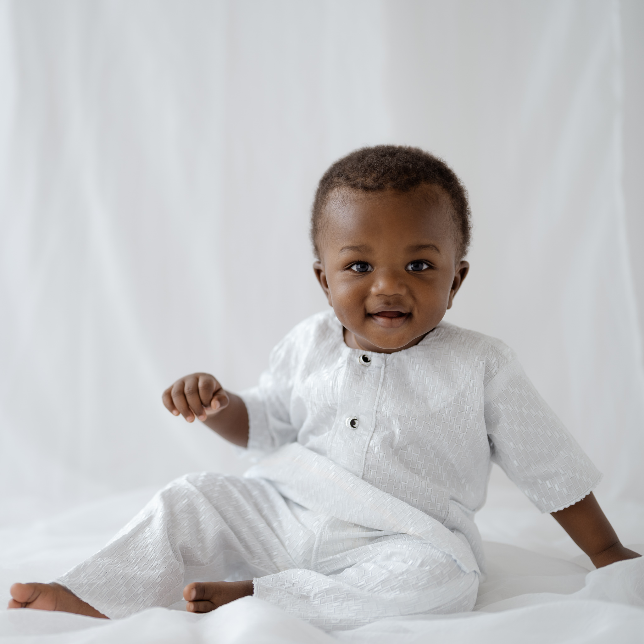 Light and airy cultural milestone photoshoot in Fort Worth studio.